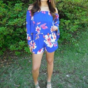Blue romper with a floral pattern